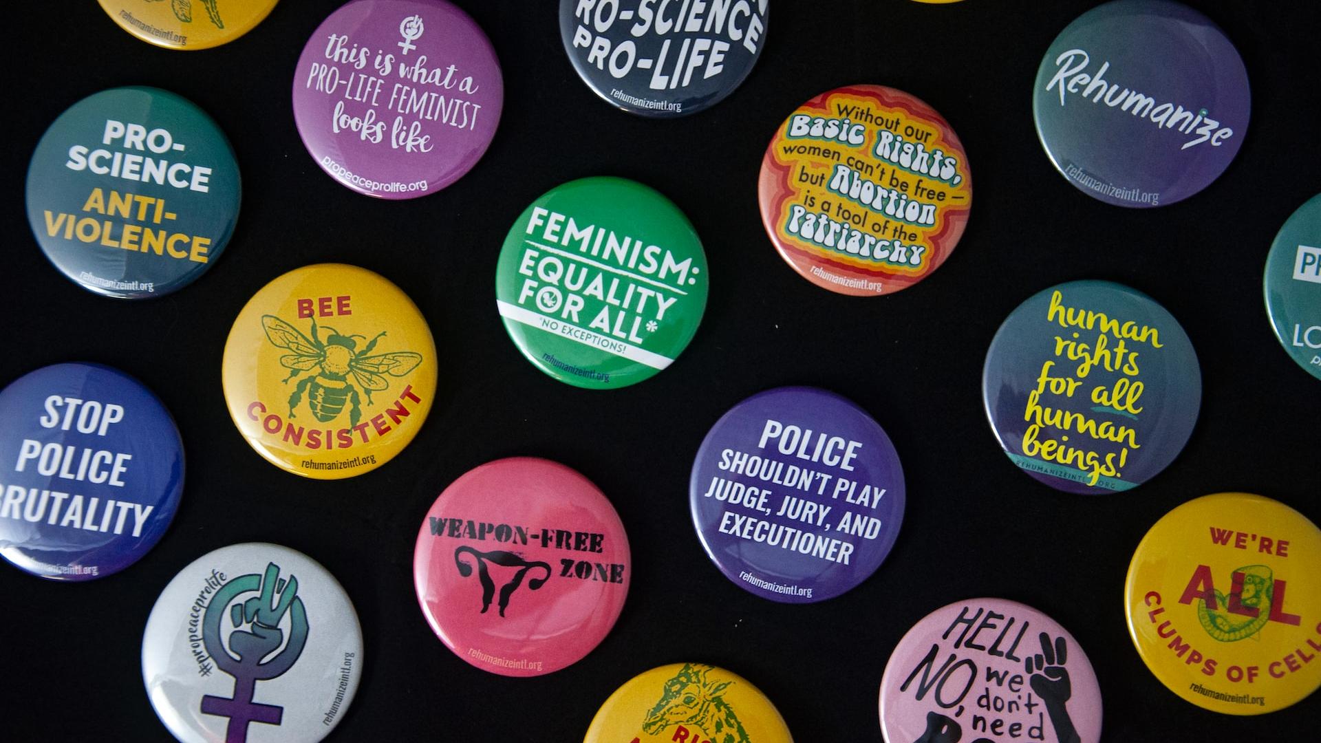 assorted-color pin back badges