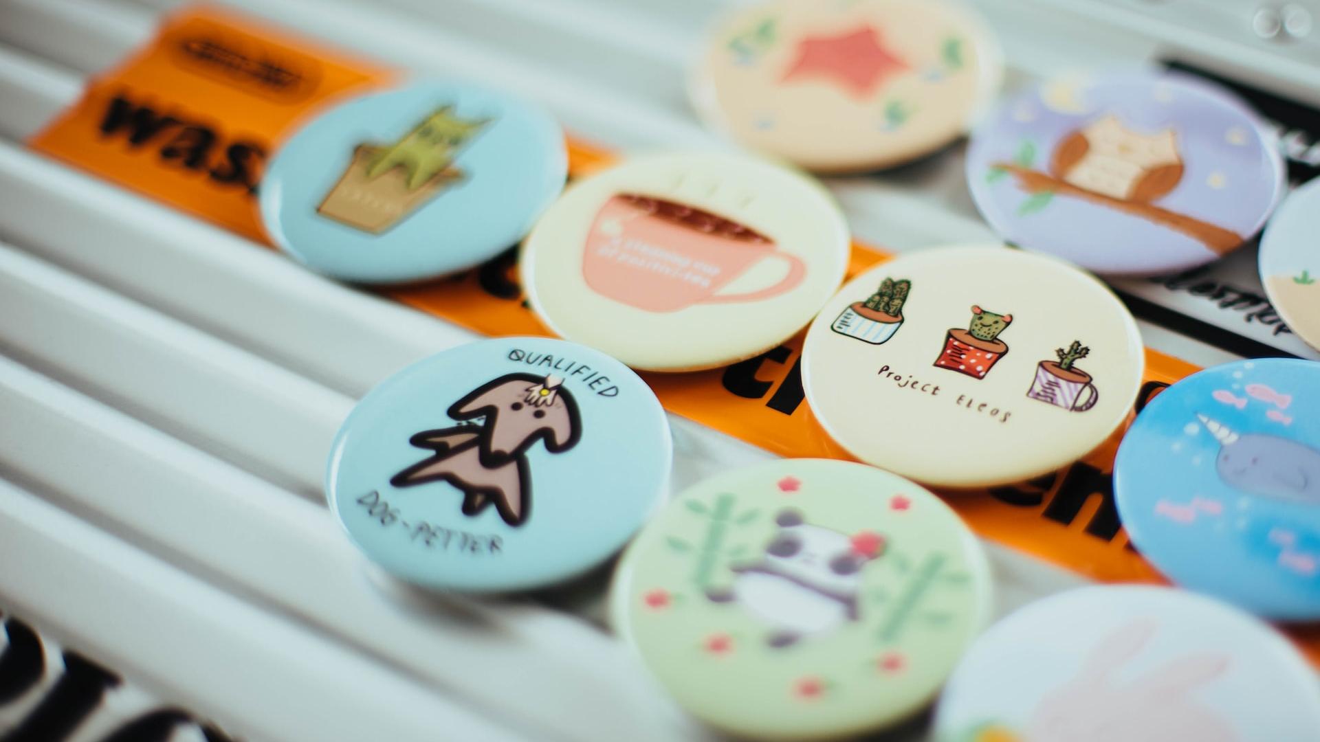 assorted-color button pins on top of white surface